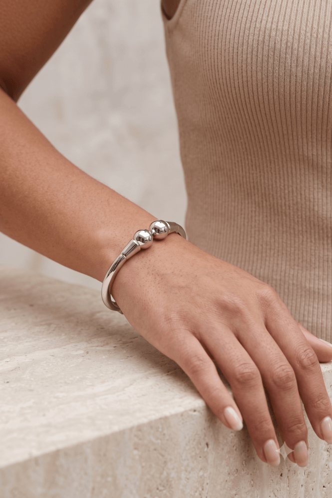 Hinged Orb End Bangle in Silver Tone - Image 2